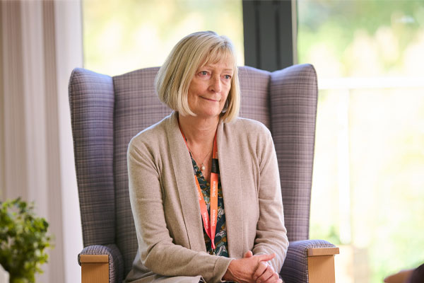 Counsellor for emotional and bereavement support sat in chair listening to patient