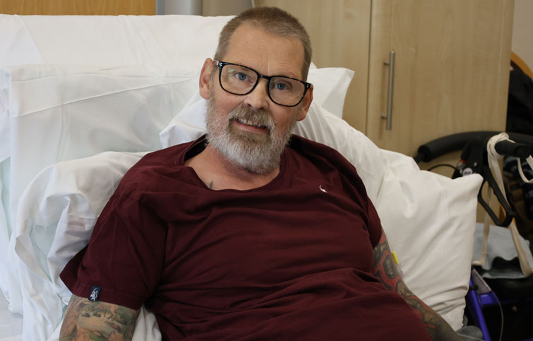 Image: David in a bed at St Helena Hospice