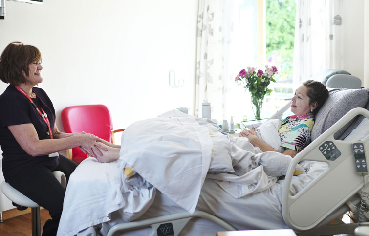 Image: Daisy in the Hospice having reflexology