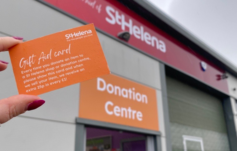 Gift Aid card in front of the donation centre