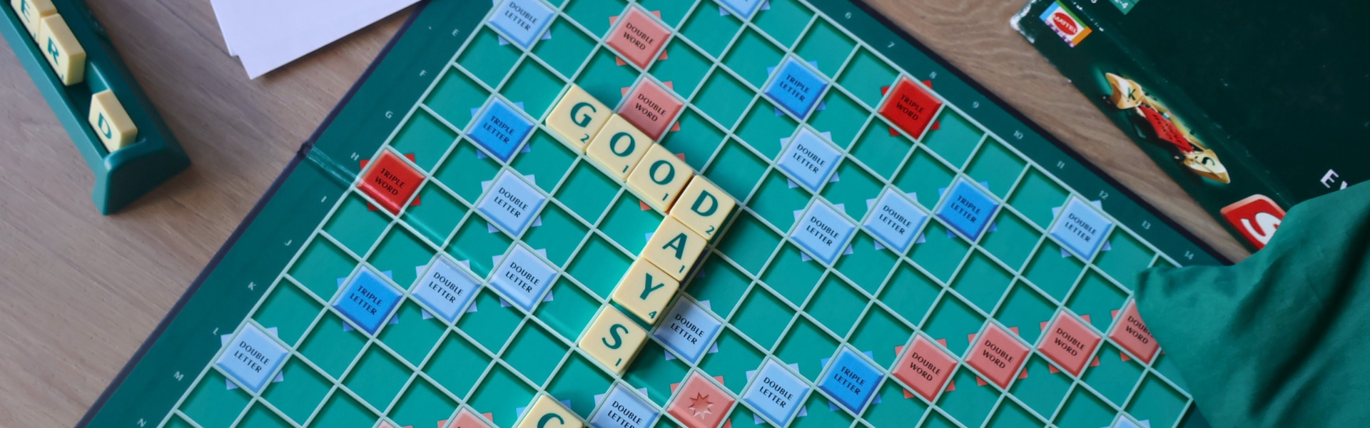 A scrabble board that says good days on it