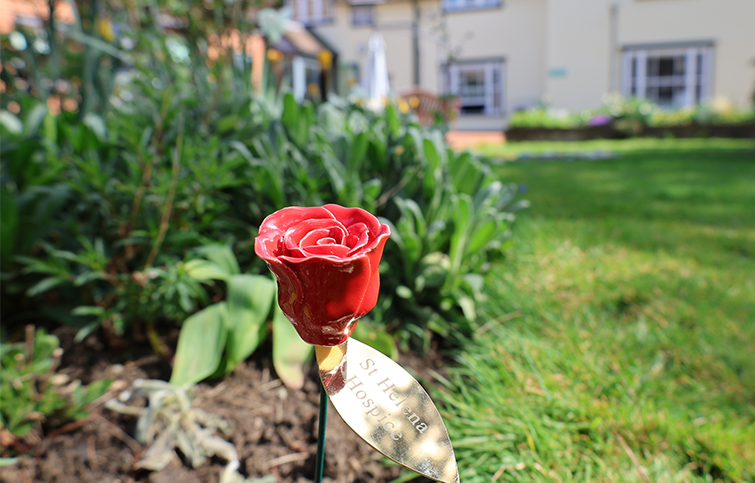 Ceramic Ruby Rose on display in the hospice garden