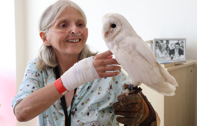 Image: Catherine with an owl at St Helena Hospice