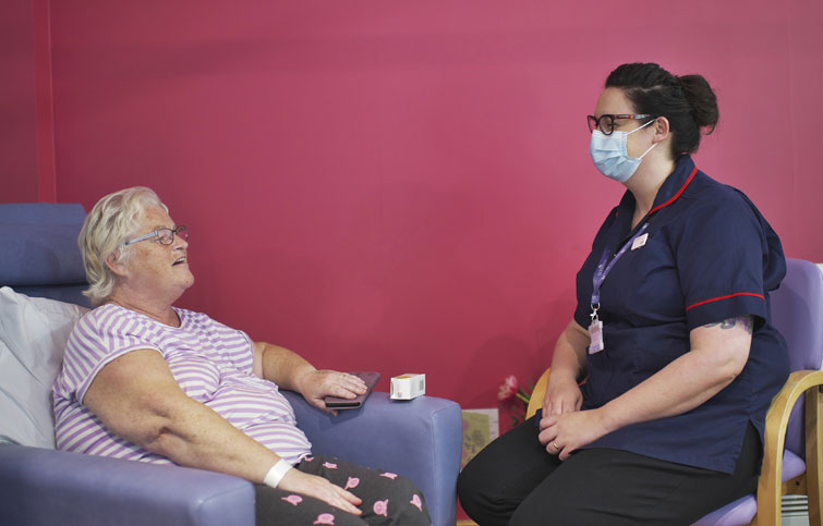 Image: Rosie at the hospice talking to hospice matron