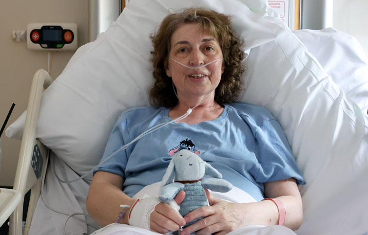 Image: patient in bed at St Helena Hospice