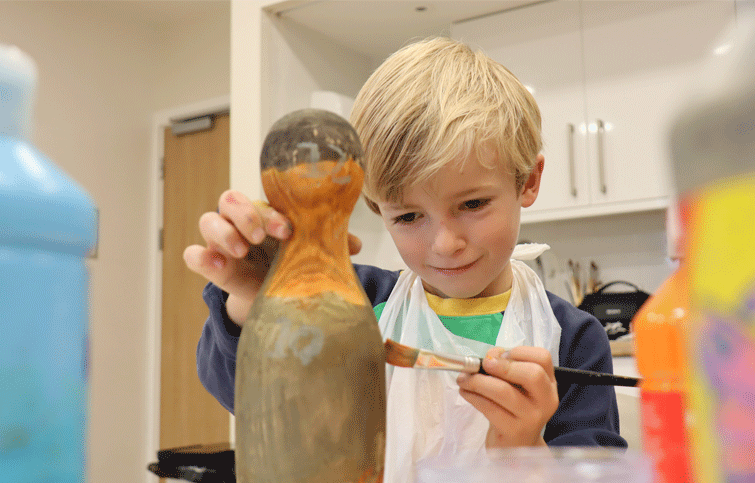 Image: painting wooden ducks