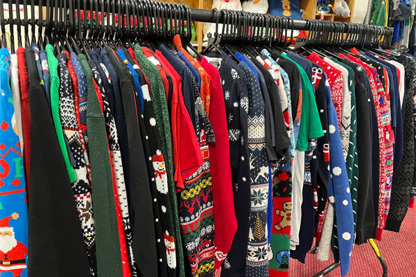 Rail of preloved sustainable Christmas jumpers
