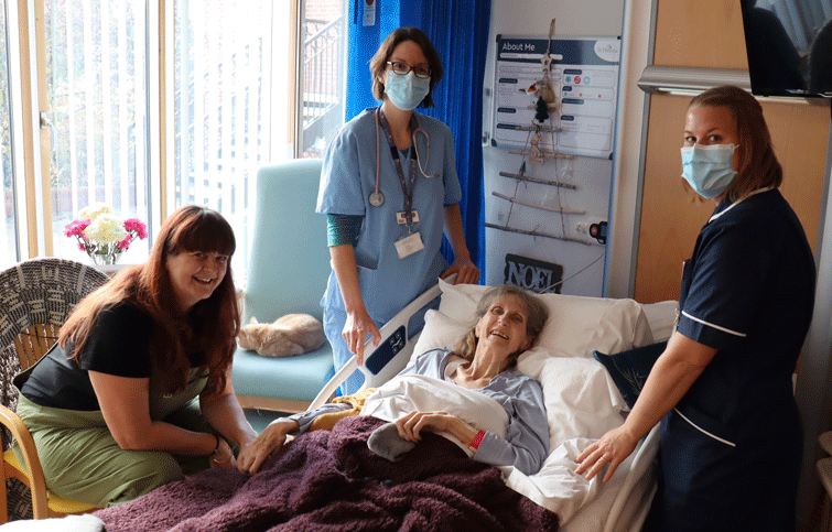 Image: Mavis and Mishelle with Hospice staff