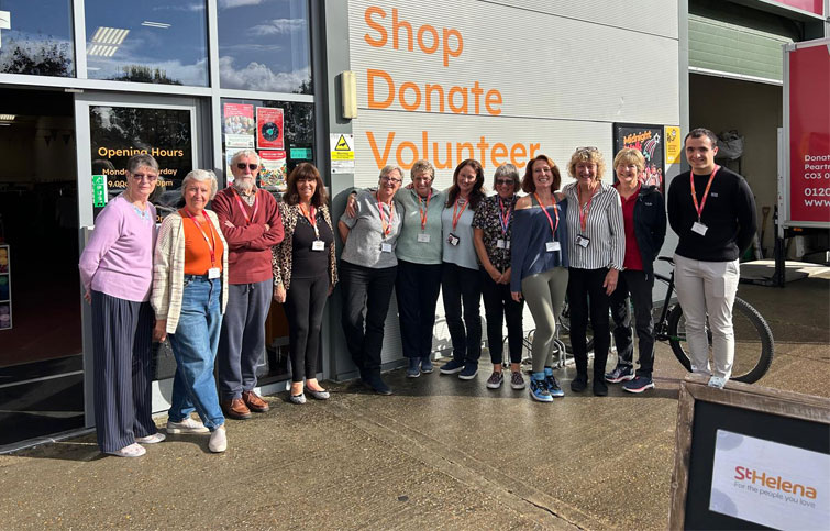 Image: Staff and volunteers at the St Helena Hospice charity shop Books, Brew and Boutique shop in Stanway