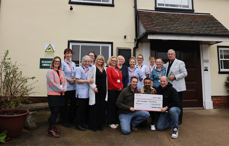 Image: Wrinkled Wheels fundraisers with nurses outside St Helena Hospice