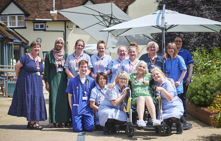 Image: Catherine with doctors and nurses at St Helena Hospice