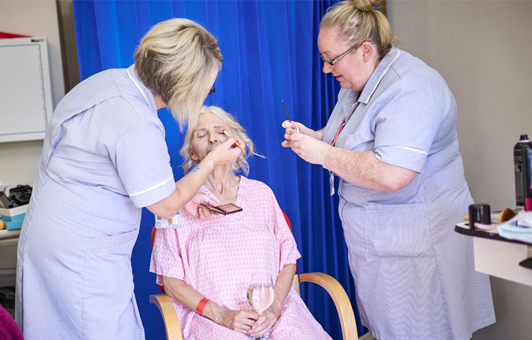 Image: Catherine having make up done by nurses for her daughter's wedding at St Helena Hospice