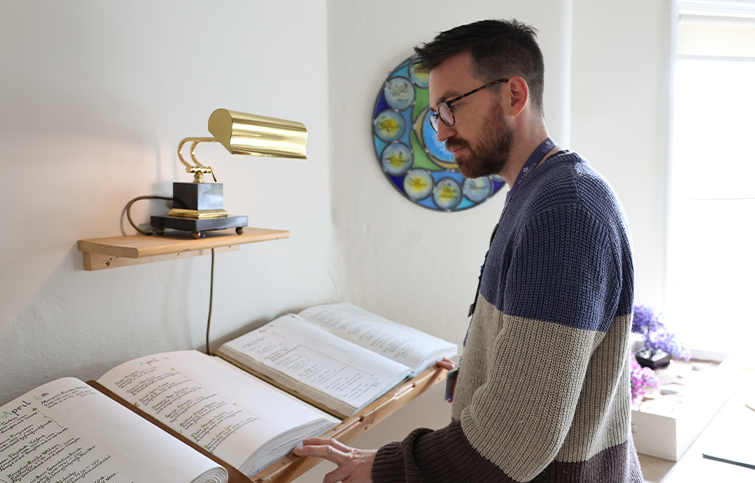 A man reads the St Helena Book of Remembrance