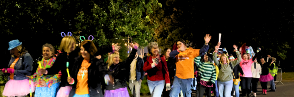 St Helena supporters walking the Midnight Walk, waving and having fun!