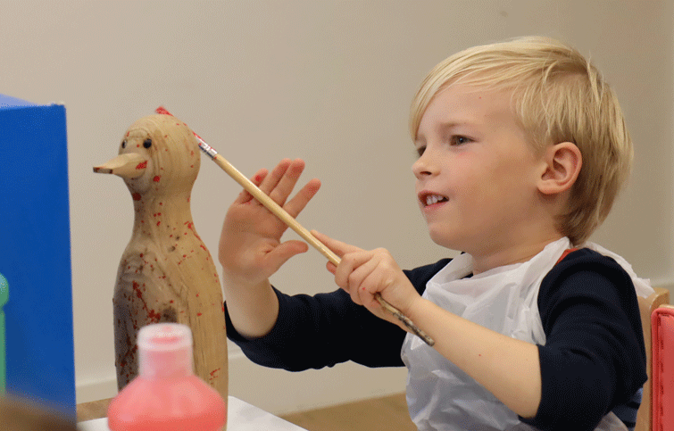 Image: painting wooden ducks