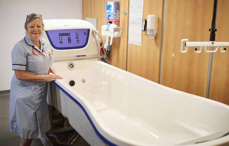 Image: nurse with patient bath at St Helena Hospice