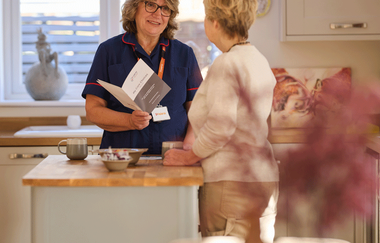 A nurse talking somebody through the benefits of using the My Care Choices Register