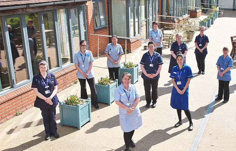 St Helena healthcare staff smiling in the hospice garden