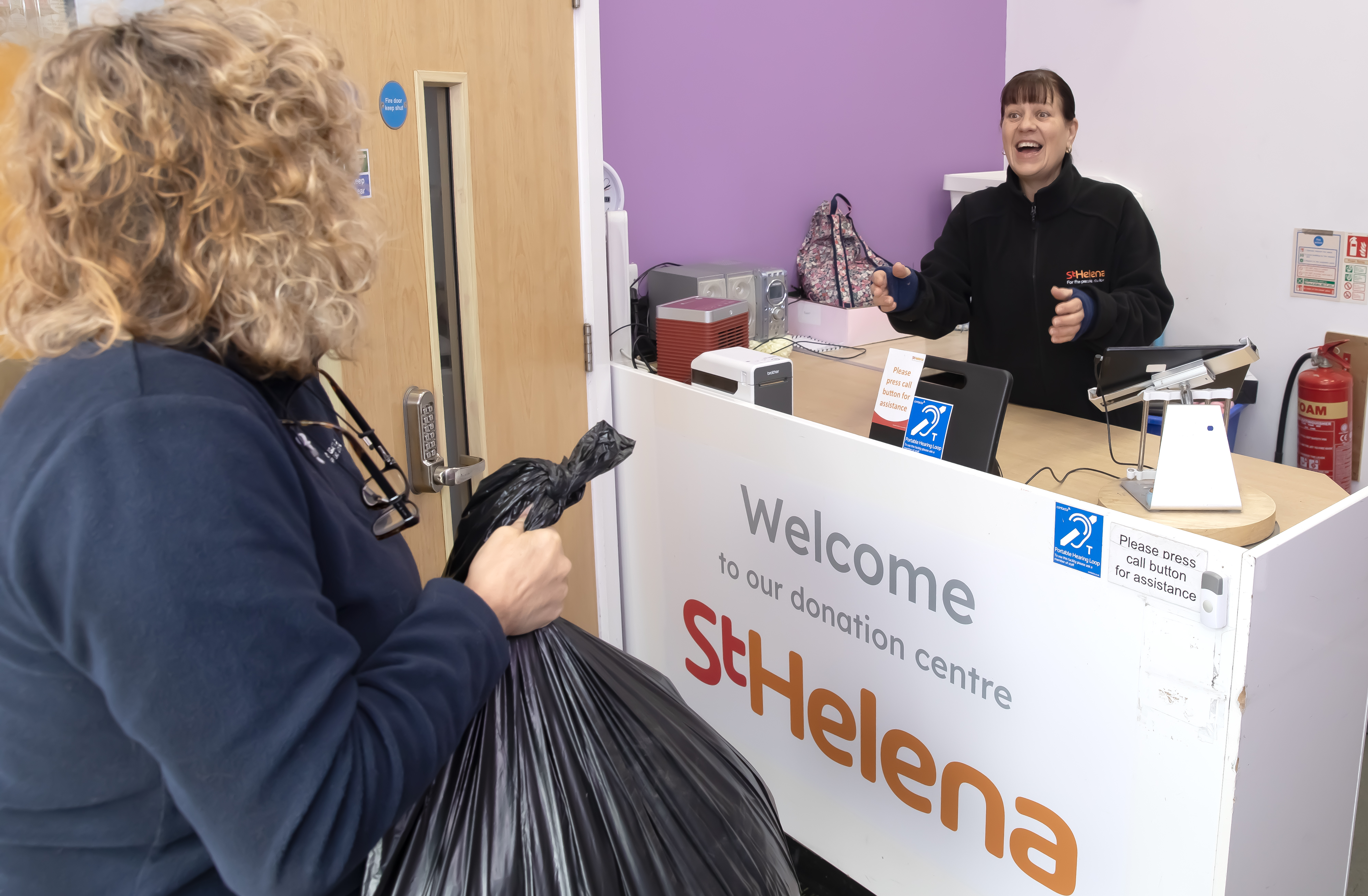 Customer donating items at a St Helena donation centre