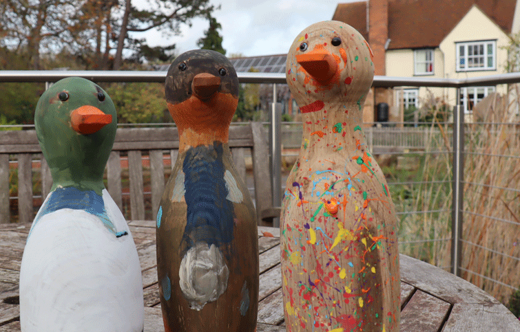 Image: painted wooden ducks