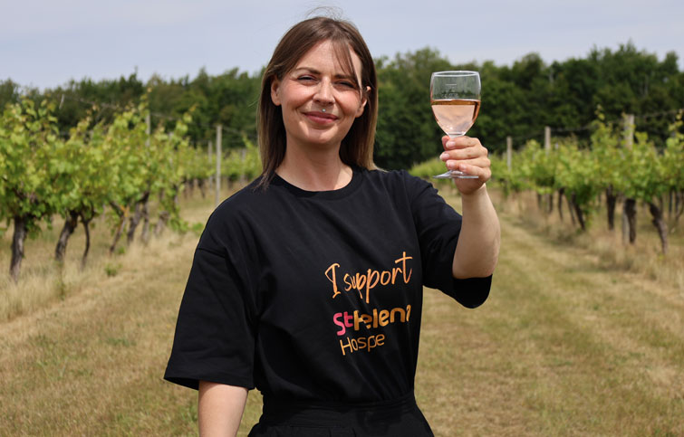 Image: Kayleigh Jowers, senior events fundraiser, Raising a glass to 40 years of St Helena Hospice pictured at at Dedham Vale Vineyard
