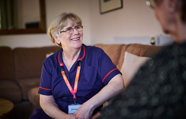 A Hospice in the Home nurse standing outside Clacton Pier ready to help the community of Clacton