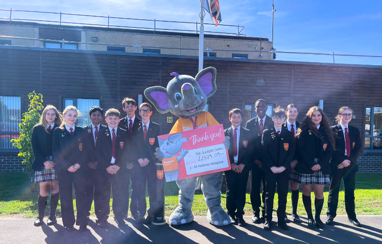 Students from the Gilberd School presenting funds they raised for St Helena Hospice