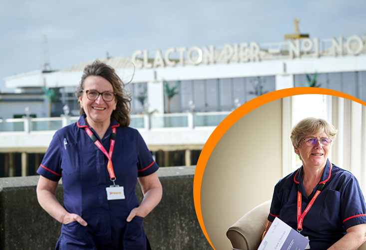A Hospice in the Home nurse standing in front of Clacton Pier ready to deliver care to Clacton